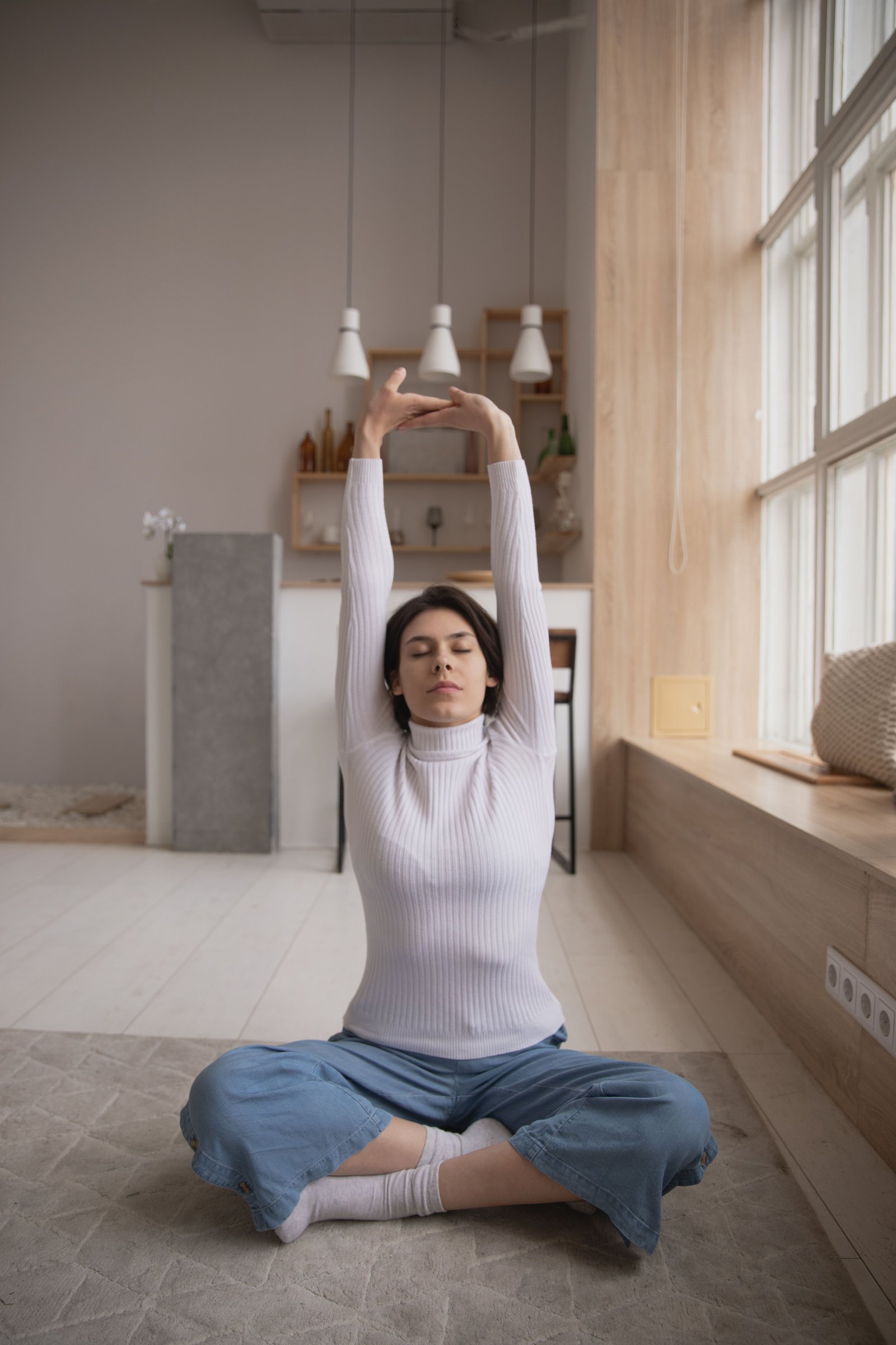Instructor demonstrating a grounded yoga pose